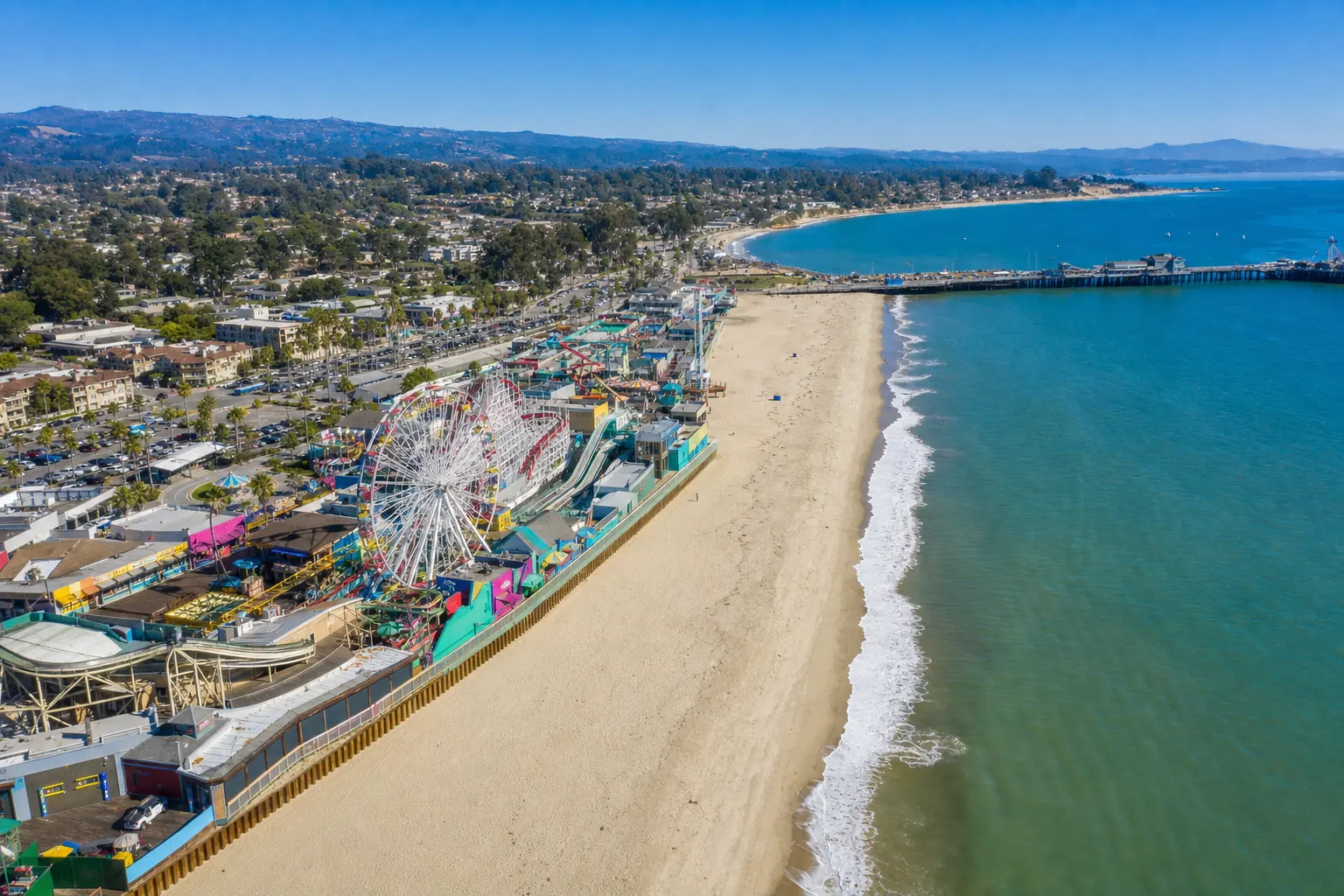 Aerial view of the Santa Cruz Beach Boardwalk and municipal wharf