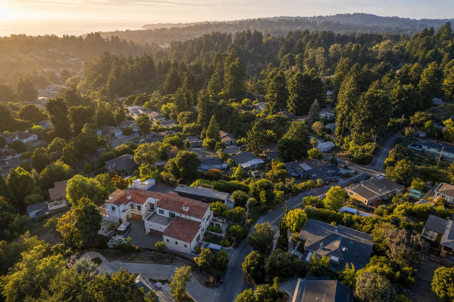 Aerial view of Soquel, California homes among redwood-covered hills