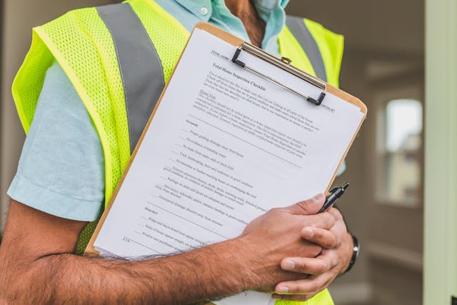 person%20holding%20home%20inspection%20checklist