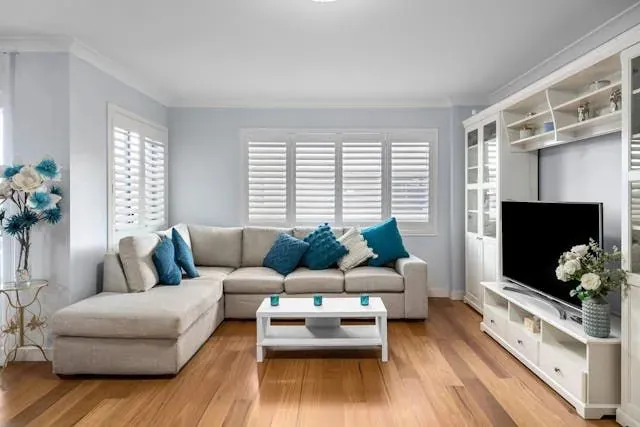 a-blue-and-white-living-room-with-a-large-white-couch a-blue-and-white-living-room-with-a-large-white-couch