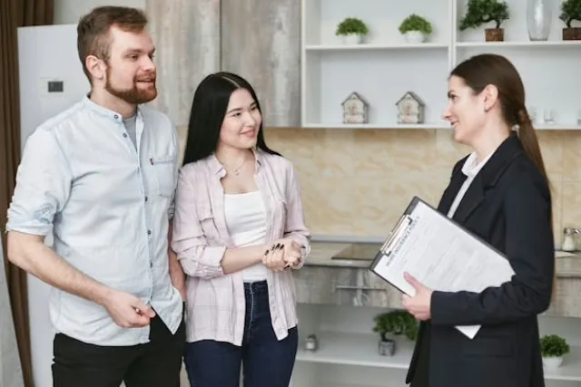 a-landlord-speaking-with-two-prospective-tenants a-landlord-speaking-with-two-prospective-tenants
