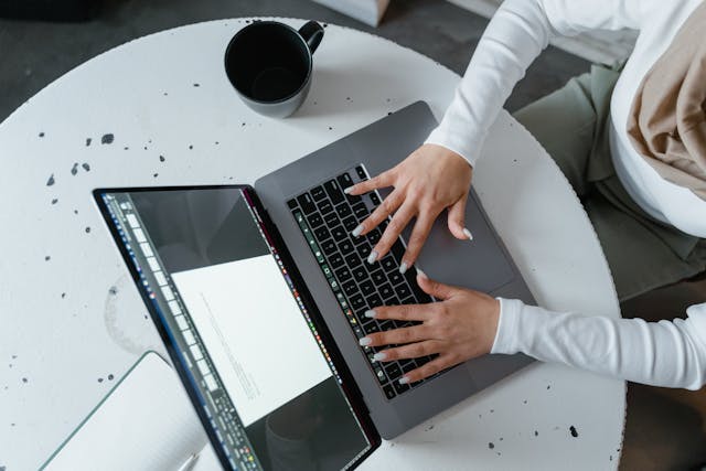 a%20person%20using%20a%20laptop a%20person%20using%20a%20laptop