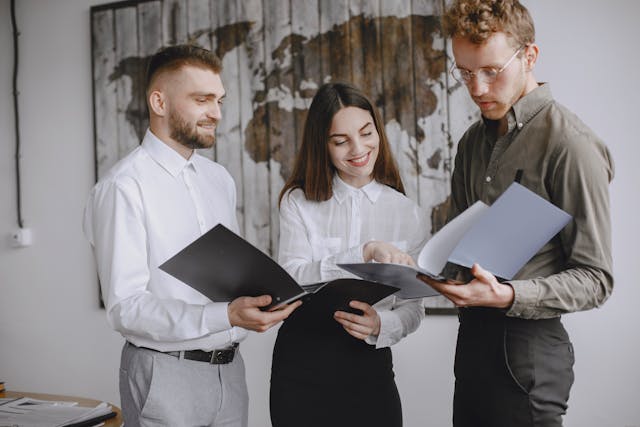 three%20business%20professionals%20talking three%20business%20professionals%20talking